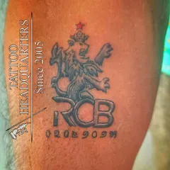 For the cricket fans. A tattoo of the Royal Challengers Bangalore (RCB) logo, complete with a special date.