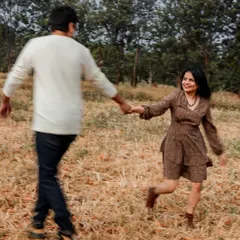 A playful, candid moment of the couple running through a field. We love capturing this kind of spontaneous energy during our outdoor lifestyle shoots.