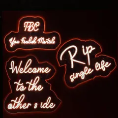 Neon signs are a fantastic way to set the mood. For this "RIP Single Life" party, we used cheeky and bold signs like 'Welcome to the other side' to create a fun, edgy atmosphere that was perfect for a pre-wedding cocktail night.