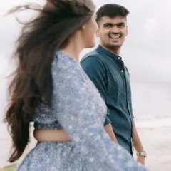 The look on his face says it all. A candid, unposed moment of pure joy and admiration during their Goa beach session.