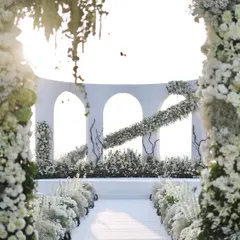 I believe wedding decor should be an ethereal experience. This all-white wedding ceremony set in Goa features clean architectural lines softened by a cascade of white florals, creating a breathtaking aisle that feels like walking through the clouds.