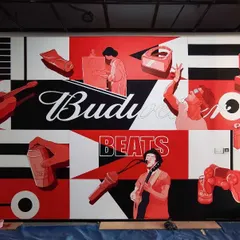 For Budweiser Beats, we created this graphic mural using their iconic red, black, and white color palette. The design features a collage of musical and lifestyle elements, capturing the brand's energetic and industrial vibe.