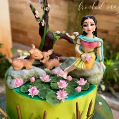 This Shakuntala-themed cake won third place at Cakeology 2022. I loved creating this serene scene with the hand-sculpted figurine, deer, and delicate lotus flowers.