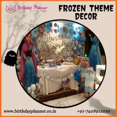 A magical Frozen theme party for Neera. This decor features a shimmering silver sequin backdrop, character standees of Anna and Elsa, and a balloon arrangement in icy blues and whites to create a winter wonderland.