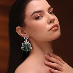 For this shot, the focus was on the stunning chandelier earrings. I kept the makeup very clean and minimal, with just a hint of definition on the eyes and a nude lip, allowing the jewelry to be the hero.