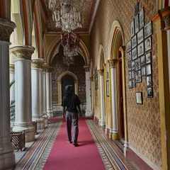 Walking down a long, ornate hallway in a palace in India. A moment of reflection on history and presence.