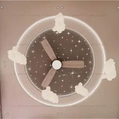 A look at the custom ceiling design, which features a starry night sky, cloud-shaped lights, and a central fan, adding to the room's magical atmosphere.