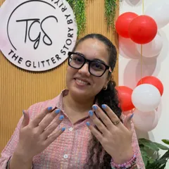 That smile says it all! She's showing off her new set of simple and chic baby blue nails.