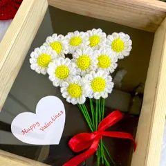A cheerful bunch of crochet daisies in a wooden shadow box frame. This piece is perfect for Valentine's Day or any day you want to send a message of happiness.