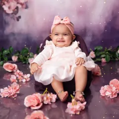 That happy, gummy smile is what milestone sessions are all about. Capturing their developing personality is our passion.