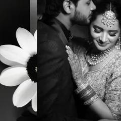 An intimate black and white portrait from Vitsal and Jagriti's reception. The groom's gentle kiss on her forehead and her serene smile make this a truly heartfelt and romantic photograph.