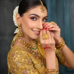 Embracing the timeless beauty of South Indian glam. This look features subtle yet defined eyes, glowing skin, and traditional gold jewelry, creating a dreamy and regal look.
