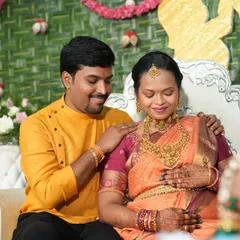 A heartwarming moment between the parents-to-be. Our client Varsha looks radiant in a full antique temple jewellery set for her baby shower ceremony.