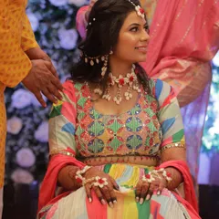A candid shot of the bride during her Haldi, her makeup staying flawless throughout the fun and festivities.