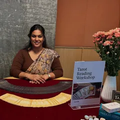 Here I am at a wellness event for WeWork, ready for a Tarot Reading Workshop. It's wonderful to see workplaces embrace tools for self-reflection and wellness. The setup was complete with fresh flowers and my favorite decks.