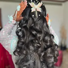 Another angle of the butterfly and pearl hairstyle, showing how the accessories are placed to create a dreamy look.