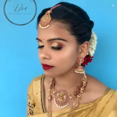 I created this timeless South Indian bridal look for a client's wedding day. It features classic gold-toned eyes, a bold red lip, and a flawless base that lasts through all the ceremonies. This is the kind of detailed bridal artistry you will master in my pro course.