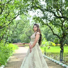 A side view of our elegant pastel green gown, highlighting the detailed embroidery and flattering A-line silhouette. It's a timeless choice for any formal celebration.