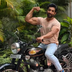 Made like a gun, goes like a bullet. Posing with a classic Royal Enfield.