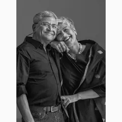 This image from a couple's portrait series captures a shared laugh and easy comfort. My aim is to create a relaxed atmosphere where genuine personalities can shine through.