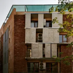 This residence in Defence Colony, Delhi, features manually sliding perforated metal 'jaalis'. These screens provide protection from the harsh sun while allowing diffused light to enter, acting as a modern interpretation of a traditional shading device.