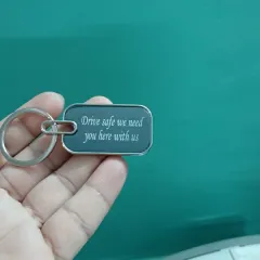 A keychain with a heartfelt message, 'Drive safe we need you here with us'. It's a small but powerful reminder for your loved ones.