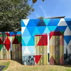 The geometric patterns and cityscape elements of the Sobha mural create a stunning visual effect. This section showcases the fusion of abstract design and realistic urban landscapes.