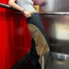 Here's a look at my custom unisex pants, designed with a wide-leg silhouette. I combined dark denim with contrasting nylon panels and athletic stripes to create a unique streetwear staple.