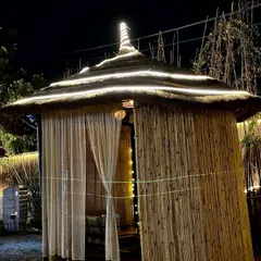 Another one of our bamboo cabanas, lit up at night. The design provides privacy while still allowing you to feel the open air and evening breeze.