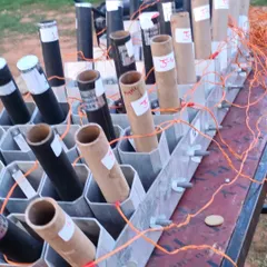 Another angle of the firework setup, showing the labeled tubes ready for a grand wedding celebration.