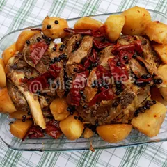 My Lamb Roast is a complete meal, featuring tender, bone-in lamb and soft potatoes roasted together. The meat is coated in a thick masala and garnished with whole red chilies and black peppercorns for a bold, aromatic flavor.