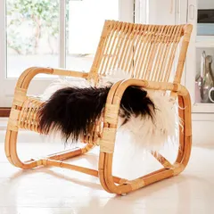 Another angle of the rattan lounge chair, highlighting the craftsmanship in the seat and backrest. This style is lightweight yet strong, suitable for both indoor and covered outdoor spaces.