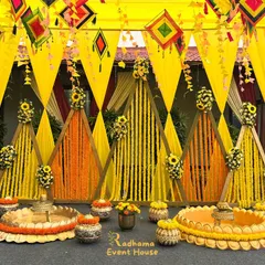 A vibrant and joyful Haldi ceremony setup, bursting with the traditional glow of yellow and orange marigolds. We designed this space with geometric backdrops, floral-filled urlis, and festive hangings to create the perfect ambiance for this fun-filled pre-wedding ritual.