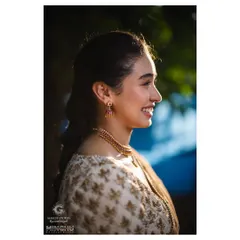 A happy, sun-kissed profile of Priyanka. The natural light beautifully highlights her glowing skin and the simplicity of her makeup, proving that less is often more.