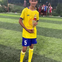 Another one of our talented players posing with his well-earned trophy after a successful tournament.