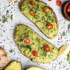 Fresh, simple, and vibrant. This overhead shot of avocado toast highlights the fresh ingredients and beautiful colors, making a simple dish look like a must-try menu item.