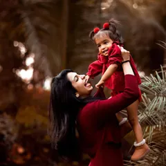 This playful moment between a mother and her daughter is priceless. Family photoshoots, especially outdoors, allow for natural interactions that result in authentic and emotional portraits.