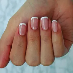 You can never go wrong with a classic French manicure. This look features perfectly shaped square nails with clean, crisp white tips for a timeless and sophisticated style.