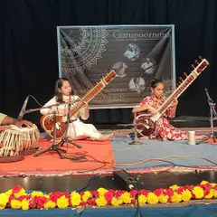 Two of my students performing a sitar duet during our Gurupoornima celebration. It is a special moment to see them share their music with others.