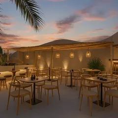As dusk settles over the 6th Empirica, the architectural lighting highlights the clean lines and natural textures of the space. The open-air design, combined with simple, elegant furniture, creates a serene setting for guests to unwind.