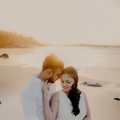 There's something magical about the golden hour light on a quiet Mumbai beach. For this pre-wedding session, we kept it simple with white outfits, letting the warm sunset and the couple's gentle interaction create a soft, romantic atmosphere.
