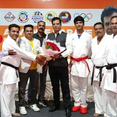 Welcoming guests and officials at the Advance Karate Kumite Seminar in Pune, Maharashtra. These seminars are crucial for disseminating advanced fighting techniques and strategies to a wider group of athletes and coaches.