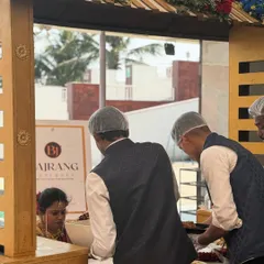 My staff is trained to be attentive and professional. Here, we are serving the main couple, ensuring their needs are met throughout the event.