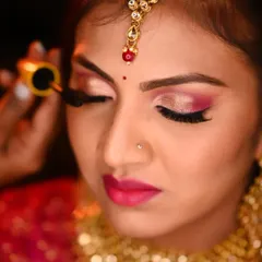 A close-up of this gorgeous doll's reception makeup. I love playing with pink and gold eyeshadows to create a look that is both vibrant and elegant.