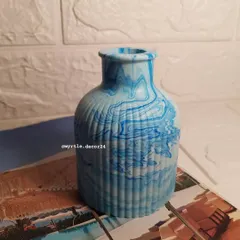 Our new Jesmonite vase, shown here in a beautiful blue marble finish. It's the perfect vessel for your favorite fresh or dried flowers, adding a touch of handmade elegance to your home.