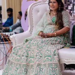 A full-length shot of my beautiful client at her baby shower. The soft green lehenga is complemented by a fresh and glowing makeup look.
