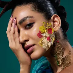 For this conceptual beauty shoot, we used pressed flowers on the skin. The lighting had to be soft enough to not wash out the delicate flowers but crisp enough to capture the skin's texture.