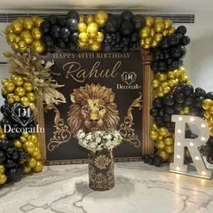 We love a bold and regal theme. For this 40th birthday, we designed a powerful black and gold lion-themed backdrop, complete with a stunning balloon arch and custom floral arrangements, creating a truly majestic photo-op.