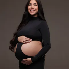 Right before their world of two became a wonderful world of three. This powerful portrait captures her strength and beauty, with makeup kept natural and glowing.