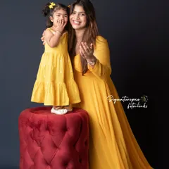 A fun and playful pose during a mother-daughter photoshoot. These candid moments of laughter and interaction create the most authentic and cherished memories.
